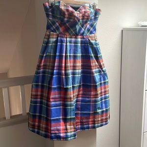 Adorable knee length plaid semi formal a line dress with pockets.